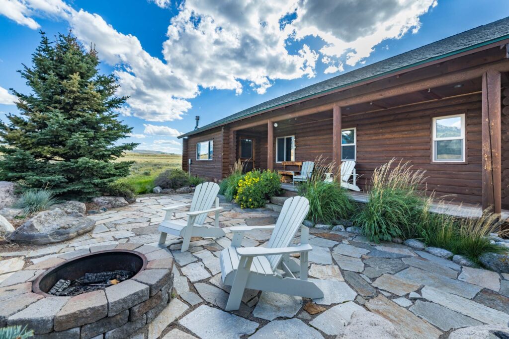 Stone patio with views of Montana mountains at custom built home.